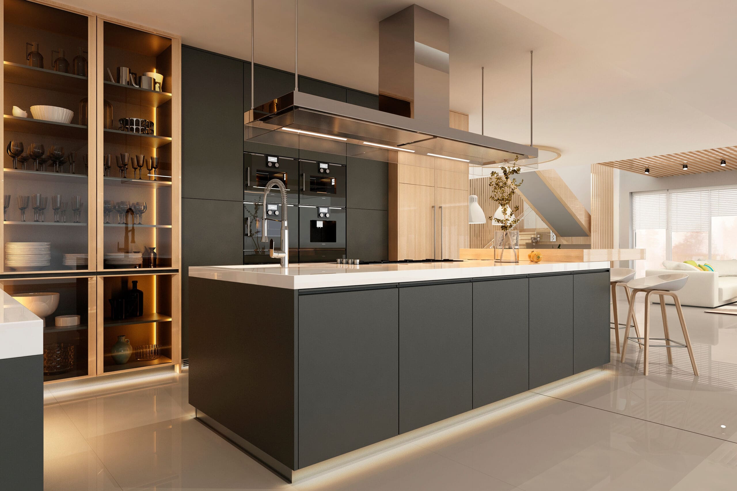 Modern kitchen with a sleek design featuring a large island with a built-in sink, dark cabinetry, and under-cabinet lighting. The kitchen includes a built-in oven and microwave, a stainless steel range hood, and decorative shelving. The space is well-lit and open.