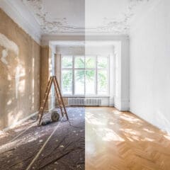 A room is shown divided in half: one side is under renovation with exposed brick, damaged walls, and a ladder, while the other side is fully renovated with white walls and a clean wooden floor.